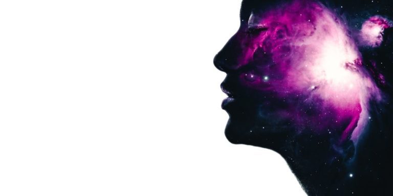 profile of person's head with galaxy inside